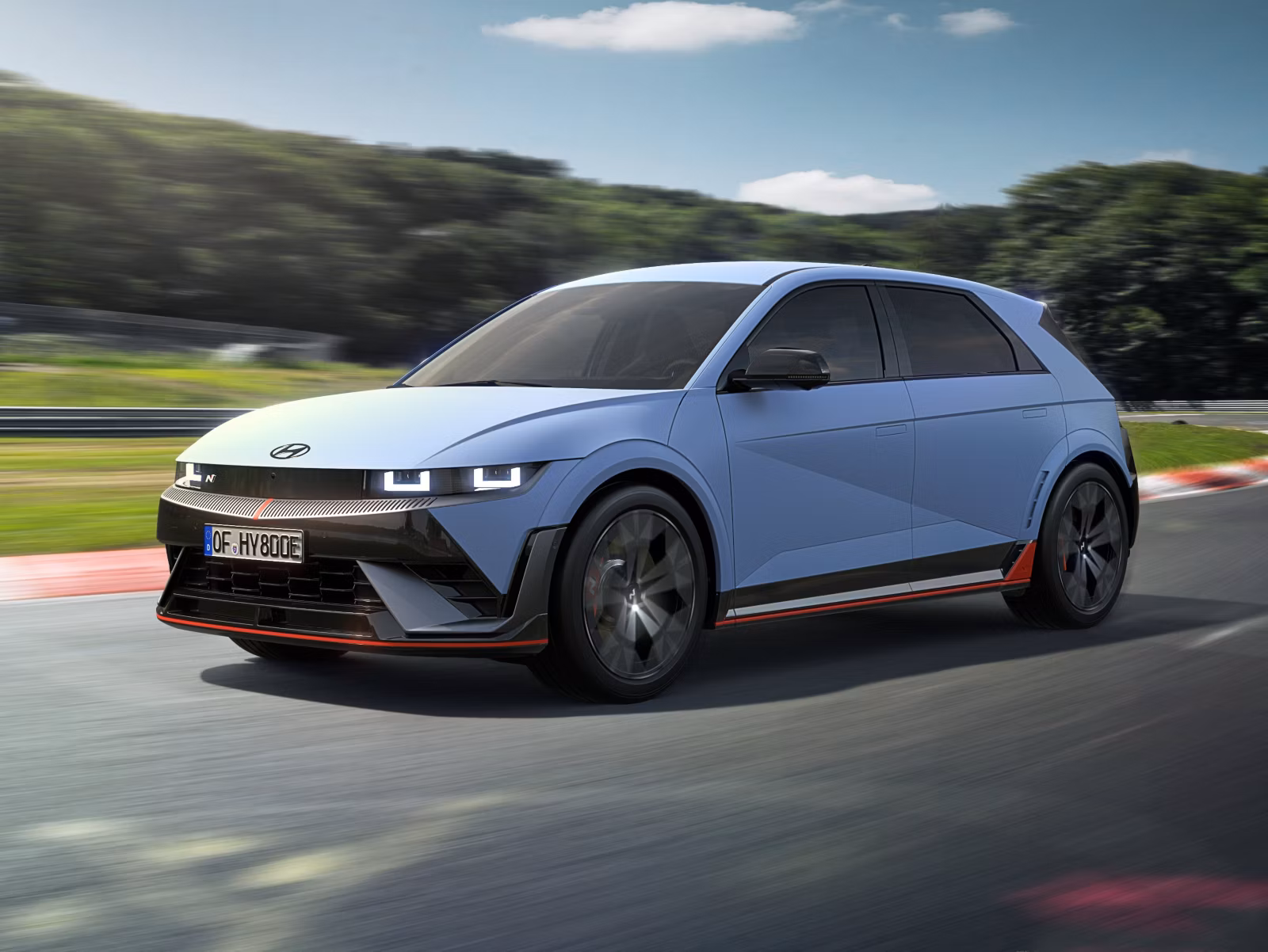 Three-quarter view of the Hyundai IONIQ 5 N driving on a racetrack. 